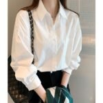 Camisa blanca de algodón puro para mujer, nueva sensación de diseño, blusa de nicho, camisa de fondo informal, camisa de manga larga de todo fósforo